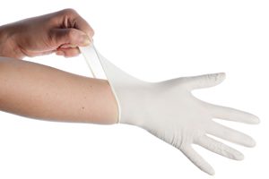 Putting On A Surgical Gloves