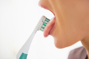 Woman Brushing Her Tongue