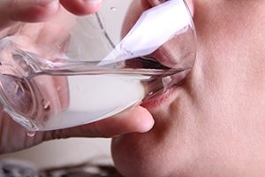 Man Drinking a Glass of Water